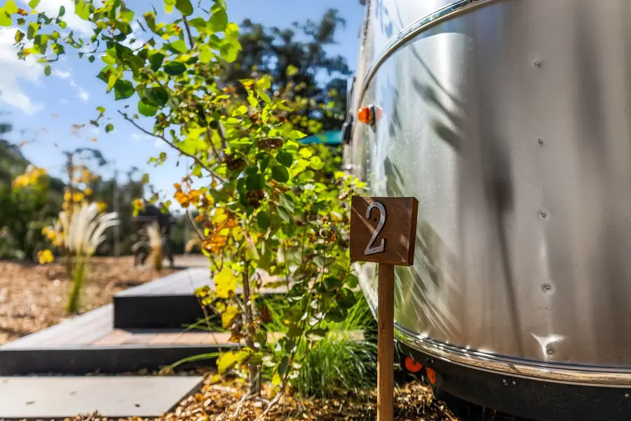 Wooden number 2 sign beside the polished side of Airstream 2A