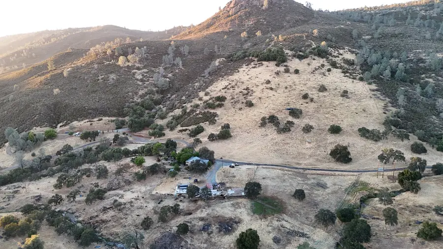Aerial view of dirt ranch roads winding through oak woodland